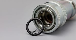 A close up of a belt on a car engine.