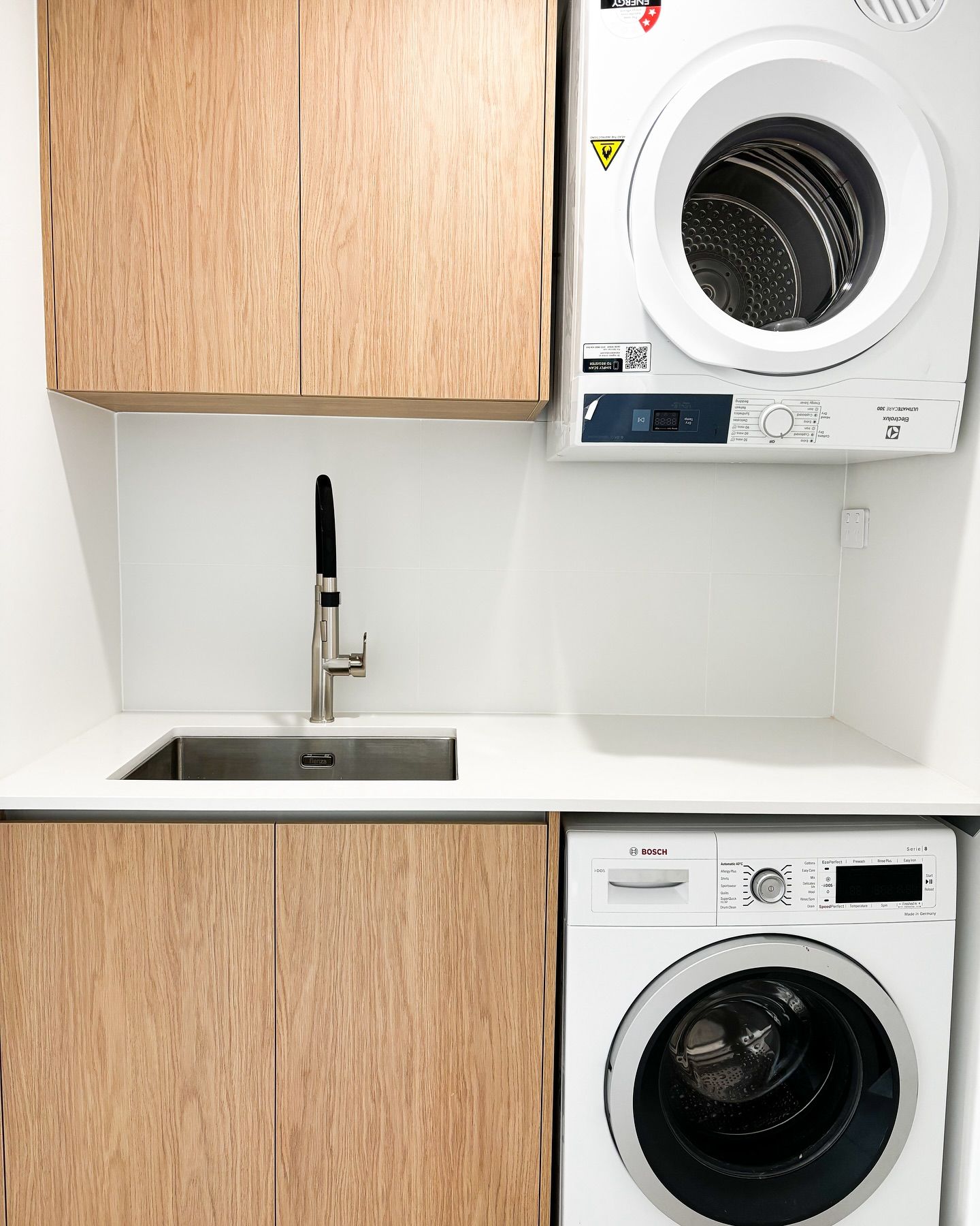 A Laundry Room With A Washer And Dryer And A Sink — Reynolds Built In Dicky Beach, QLD