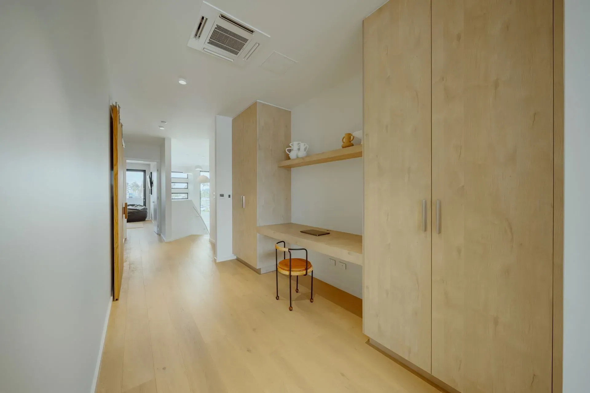 A Hallway With A Desk And A Chair In It  — Reynolds Built In Moffat Beach, QLD
