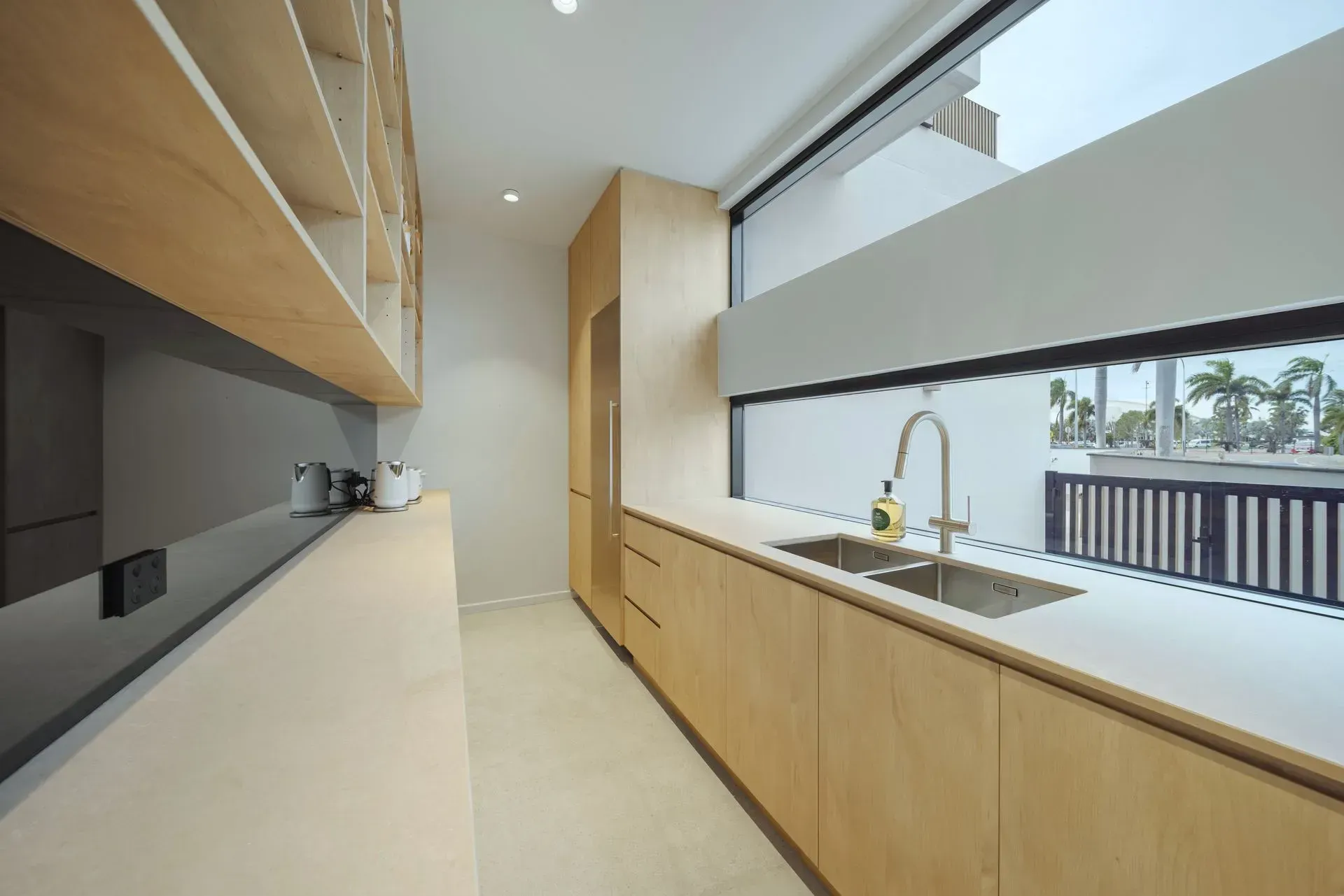 A Kitchen With A Sink And A Large Window — Reynolds Built In Dicky Beach, QLD