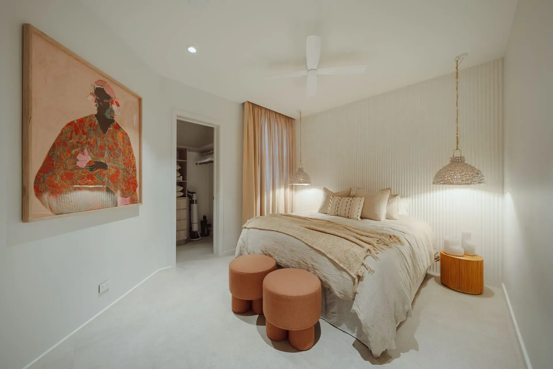 A Bedroom With A Bed, Ottomans And A Painting On The Wall — Reynolds Built In Dicky Beach, QLD