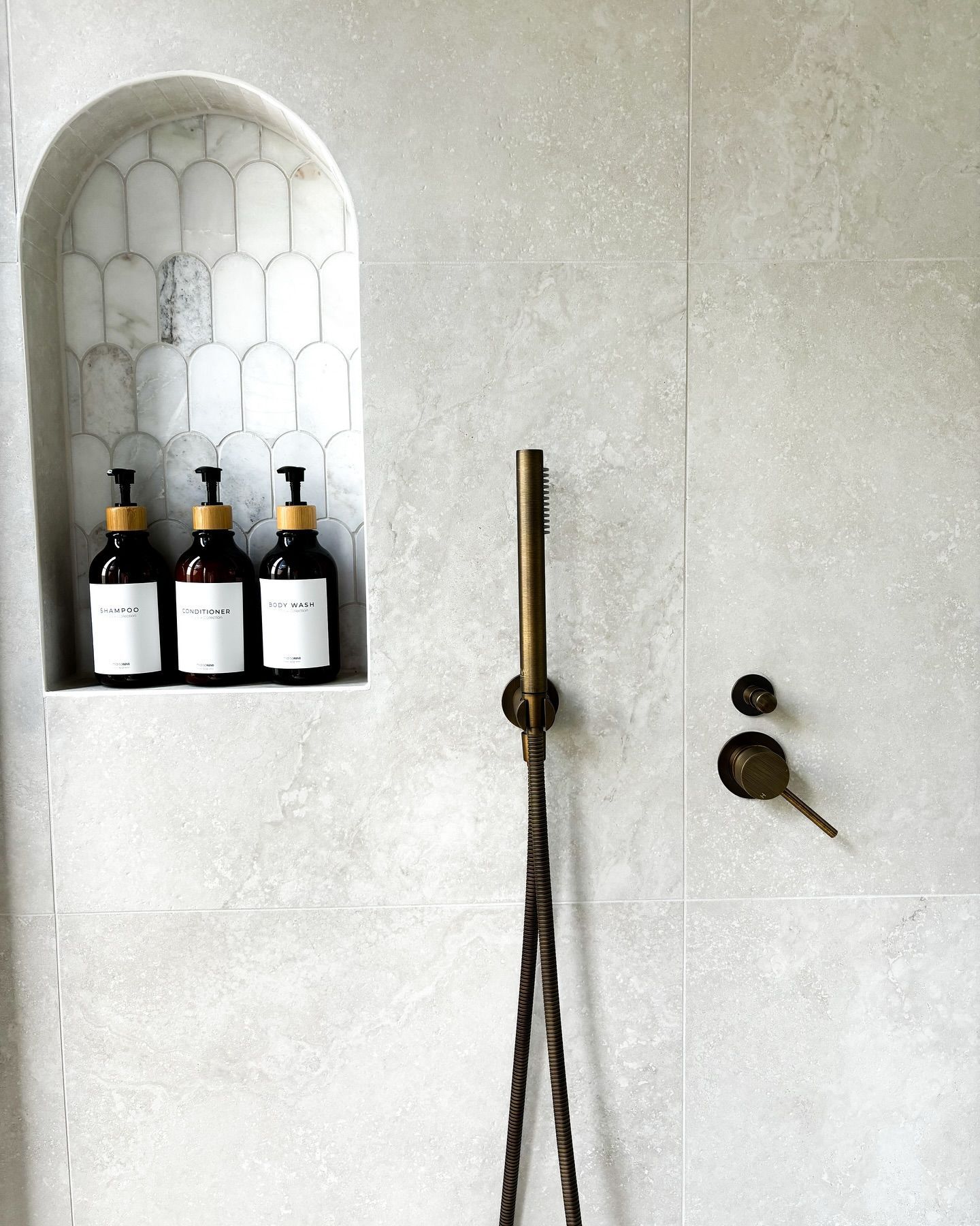 Three Bottles Of Soap Are On A Shelf In A Shower — Reynolds Built In Dicky Beach, QLD