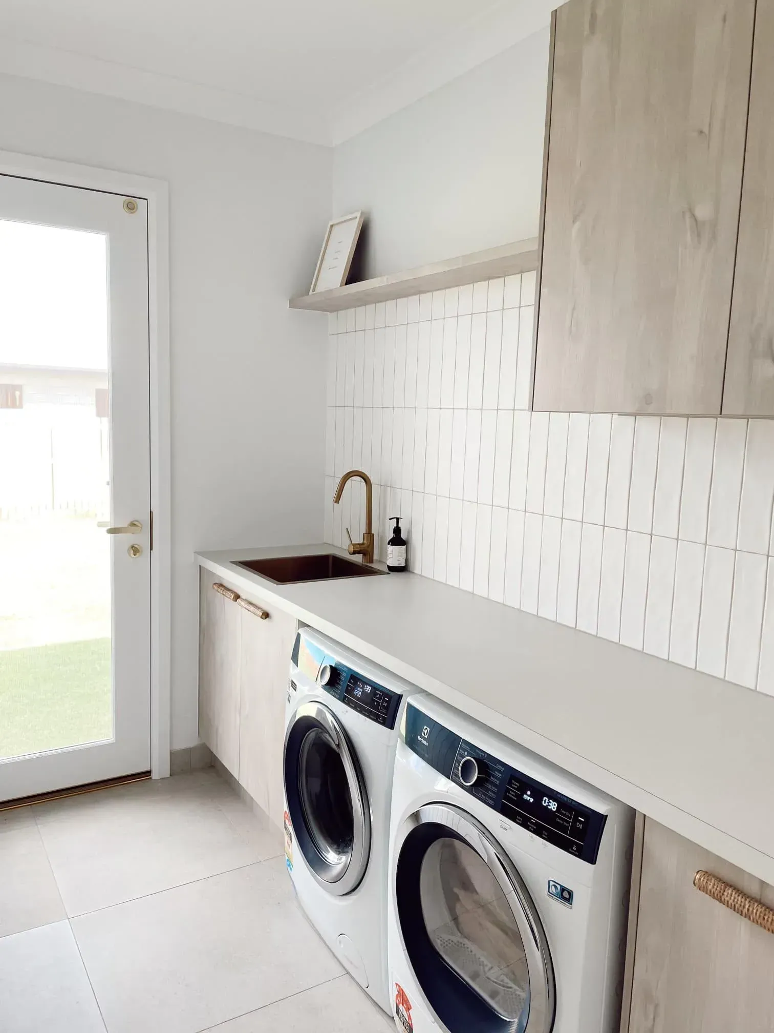 A Laundry Room With A Washer And Dryer And A Sink — Reynolds Built In Dicky Beach, QLD