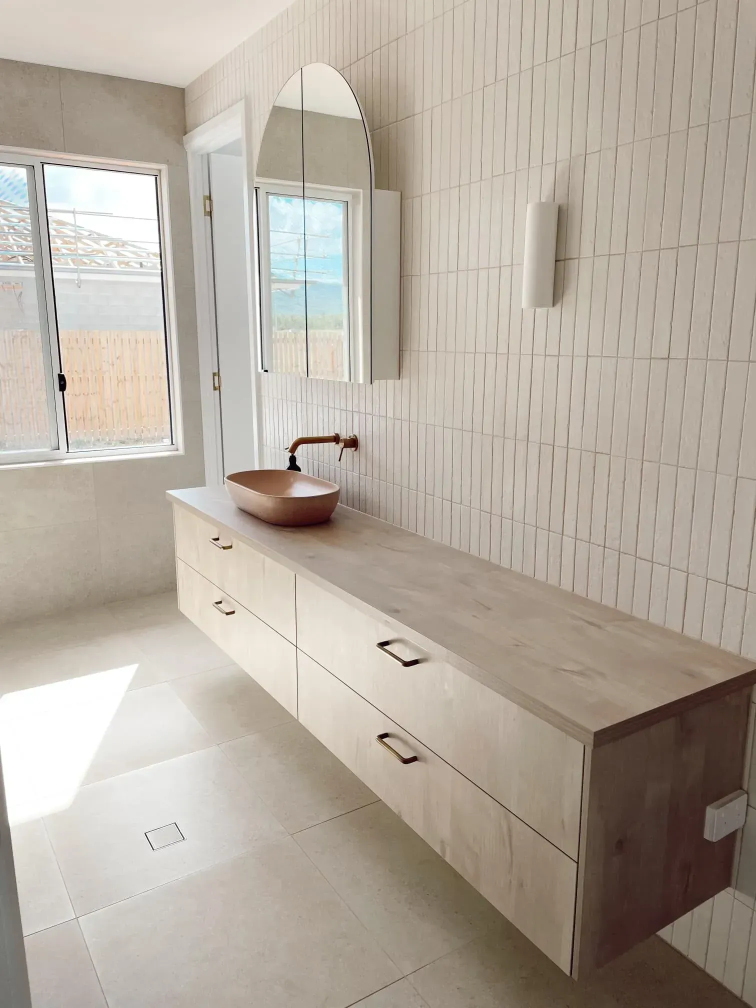 A Bathroom With A Sink And A Mirror On The Wall — Reynolds Built In Dicky Beach, QLD