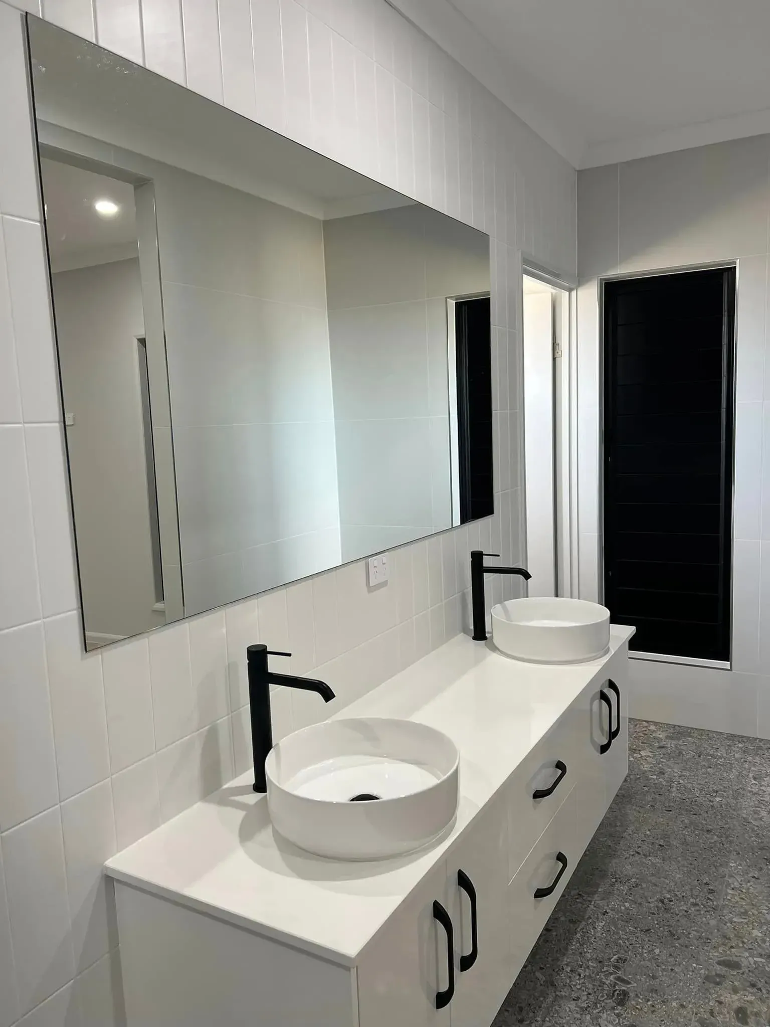A Bathroom With Two Sinks And A Large Mirror — Reynolds Built In Dicky Beach, QLD