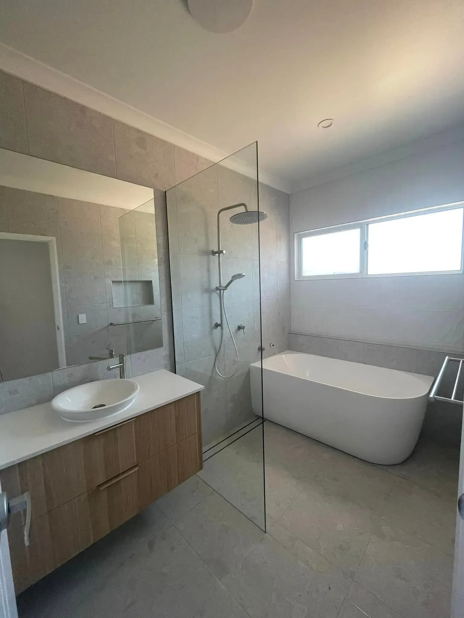 A Bathroom With A Bathtub, Sink, Mirror And Shower — Reynolds Built In Dicky Beach, QLD