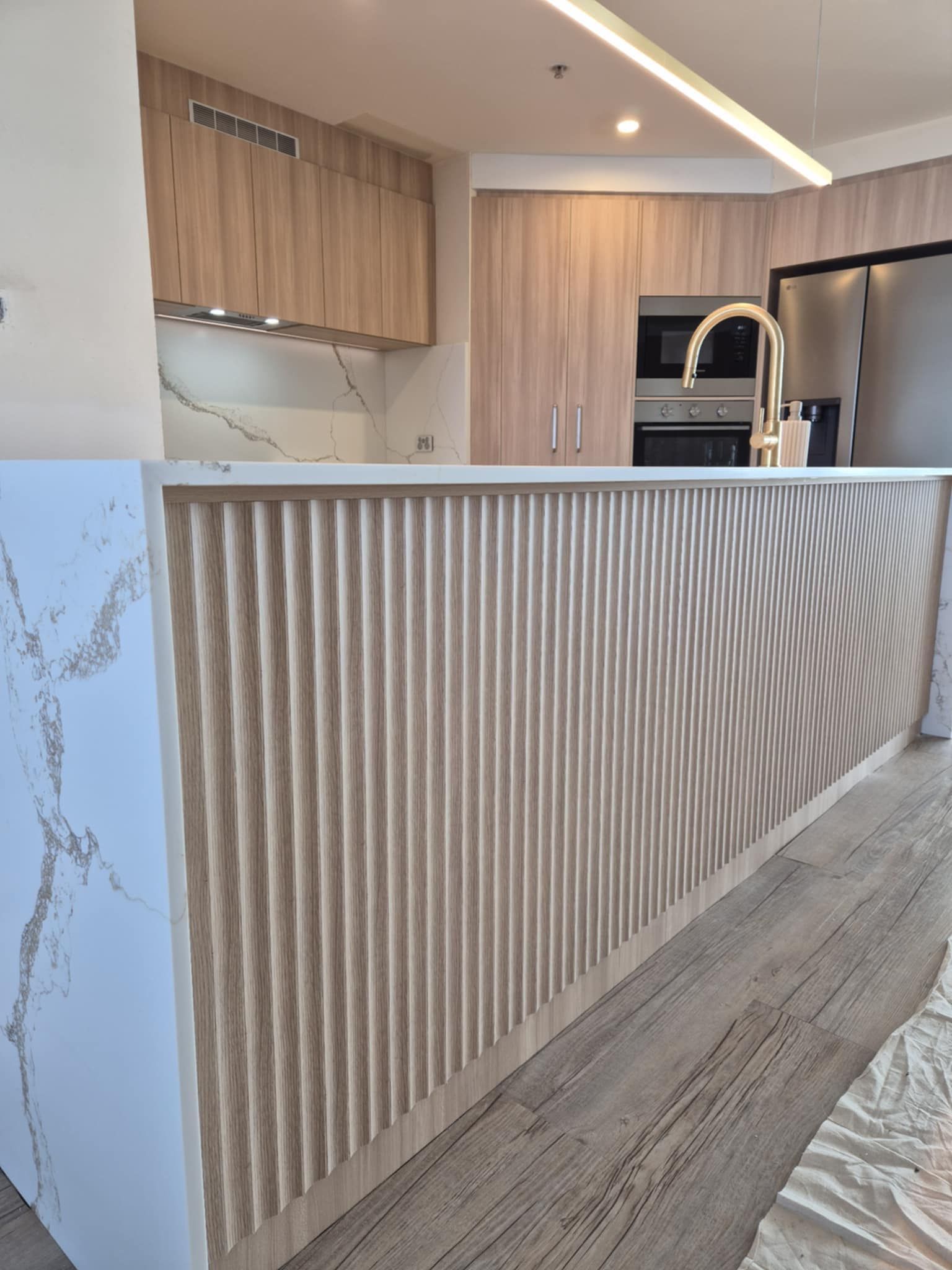 A Kitchen With Wooden Cabinets — Reynolds Built In Dicky Beach, QLD