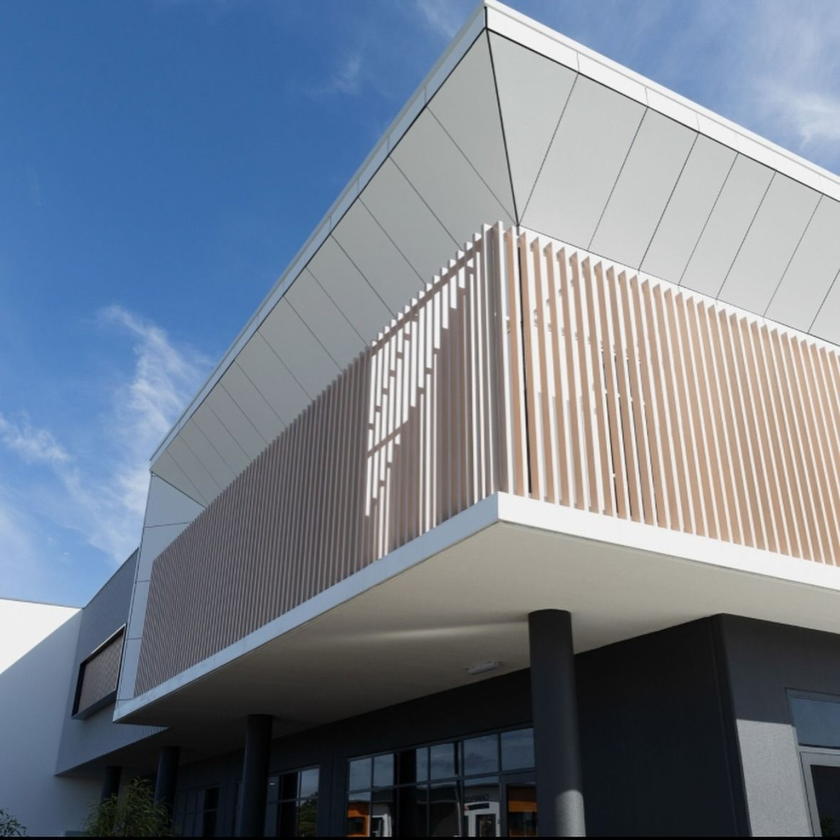 Modern Two-story Building With Light-coloured Vertical Slats Over — Reynolds Built In Caloundra, QLD