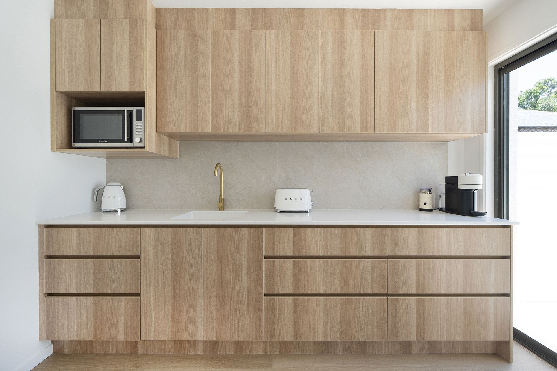 Light Wood-paneled Kitchen With Appliances — Reynolds Built In Dicky Beach, QLD