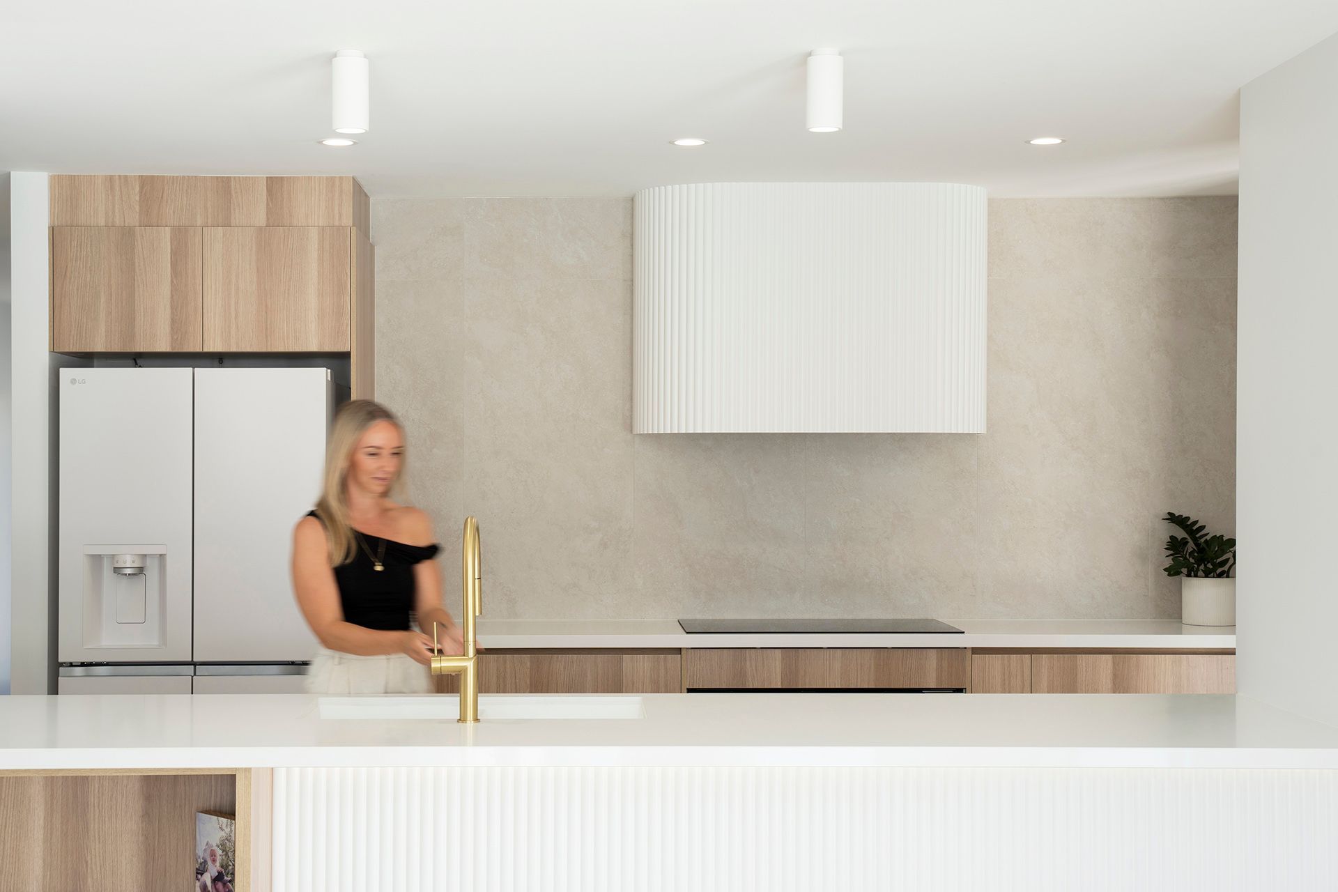 An Empty Kitchen With Wooden Cabinets And White Tile Floors — Reynolds Built In Caloundra, QLD