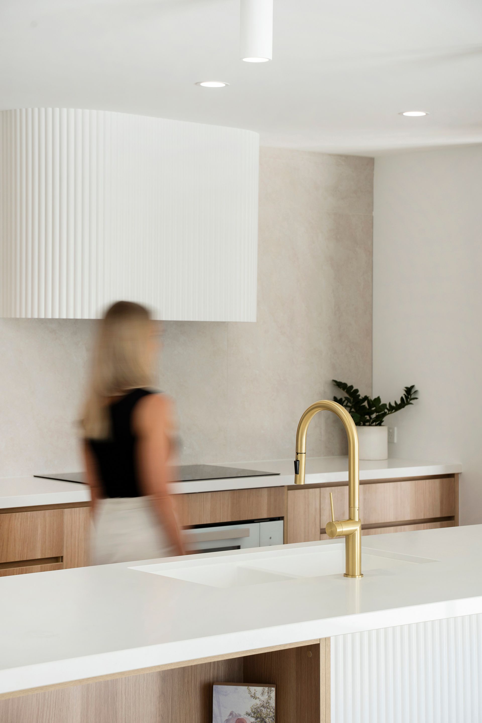 A Kitchen With Wooden Cabinets And White Counter Tops — Reynolds Built In Kings Beach, QLD
