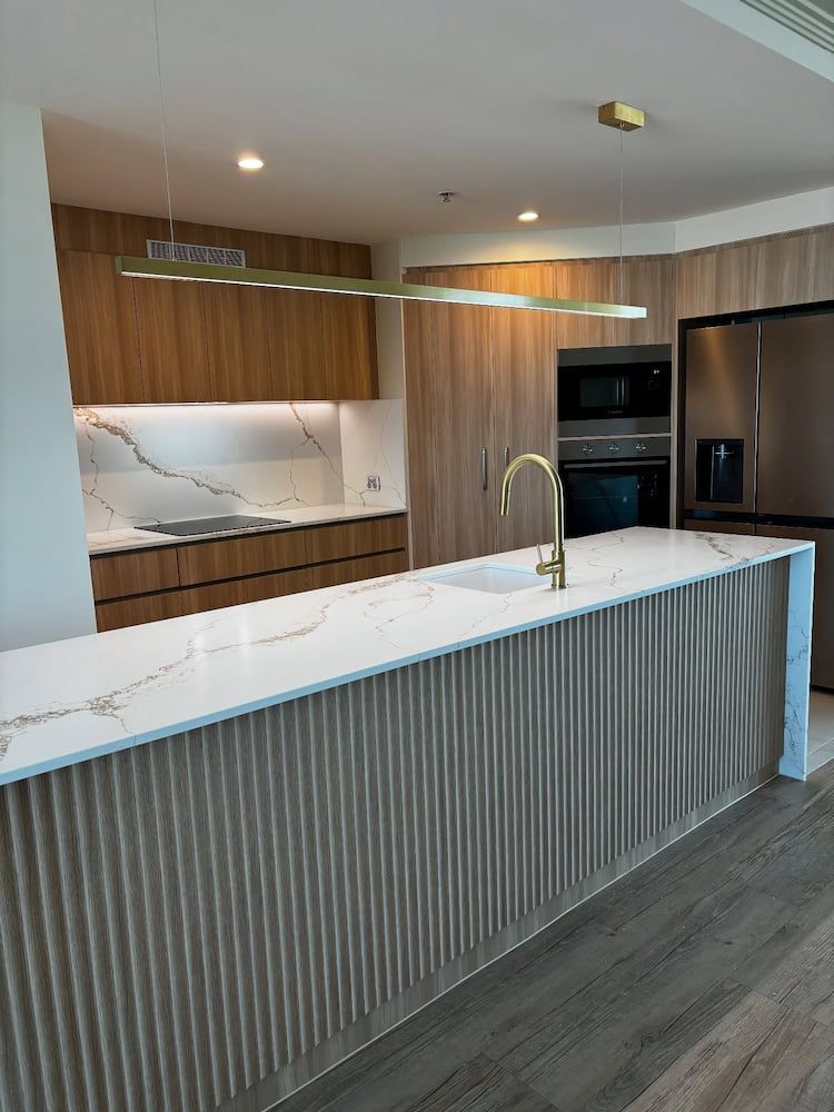 Modern Kitchen With Light Wood Cabinets — Reynolds Built In Golden Beach, QLD