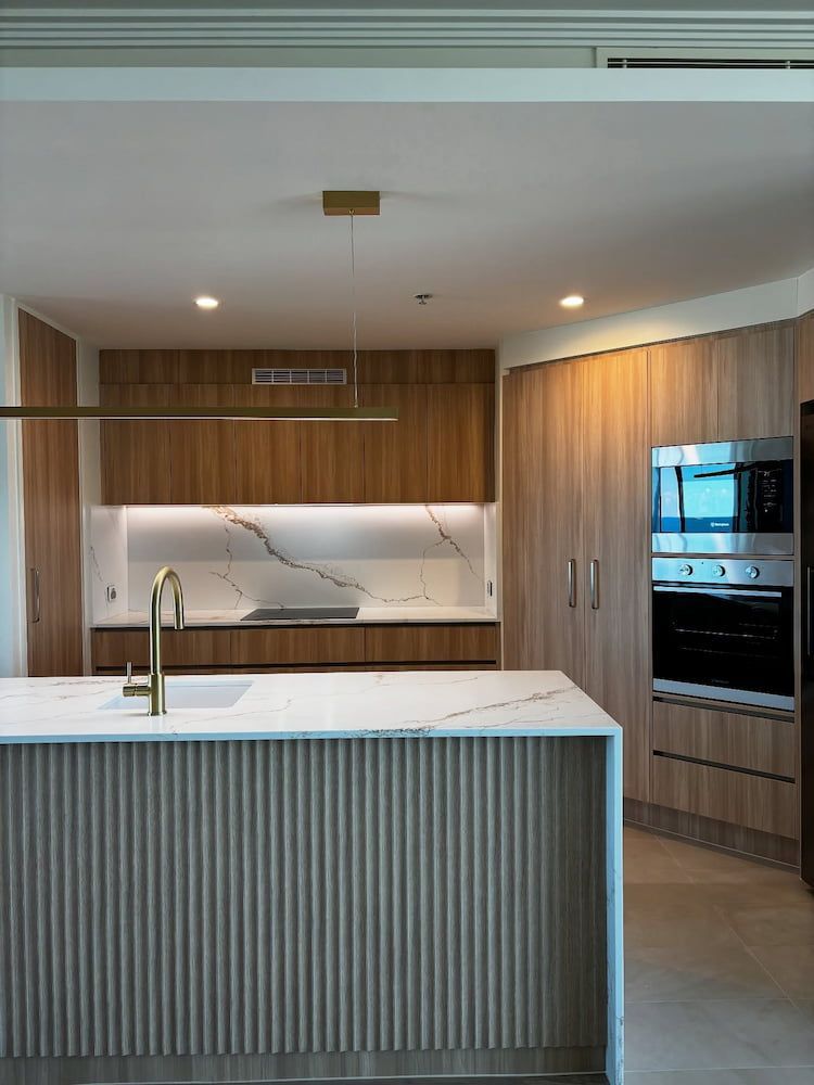 Modern Kitchen With Light Wood Cabinetry — Reynolds Built In Golden Beach, QLD