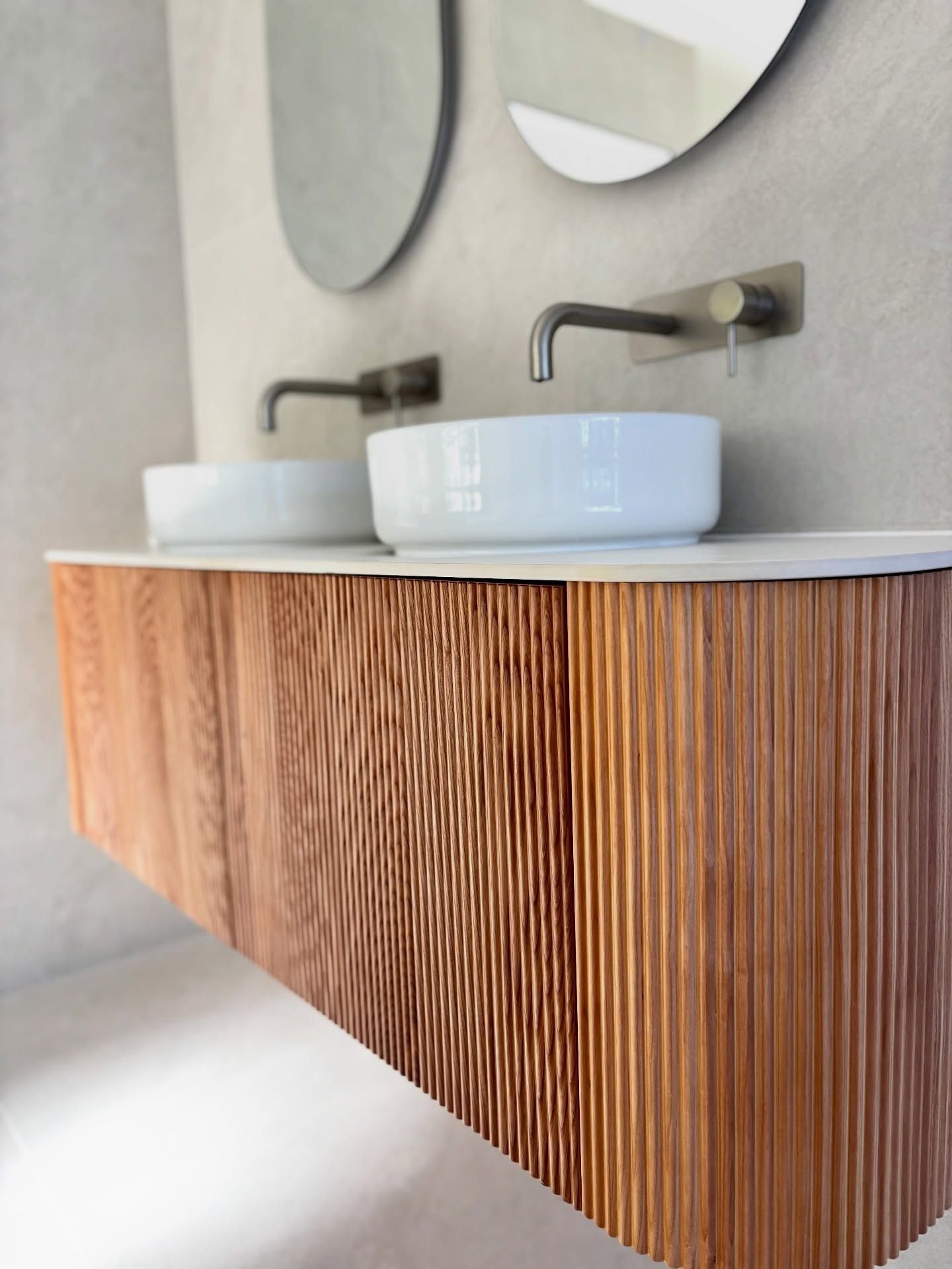 A Floating Wooden Bathroom Vanity With Ribbed Cabinetry — Reynolds Built In Caloundra, QLD