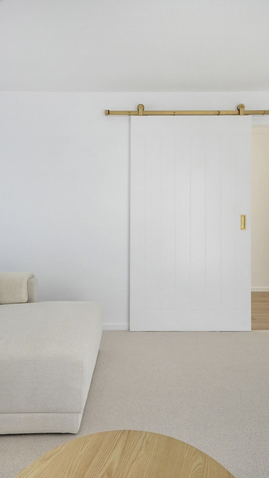 White Barn Door With Gold Hardware, in a Neutral-toned Room — Reynolds Built In Alexandra Headlands, QLD