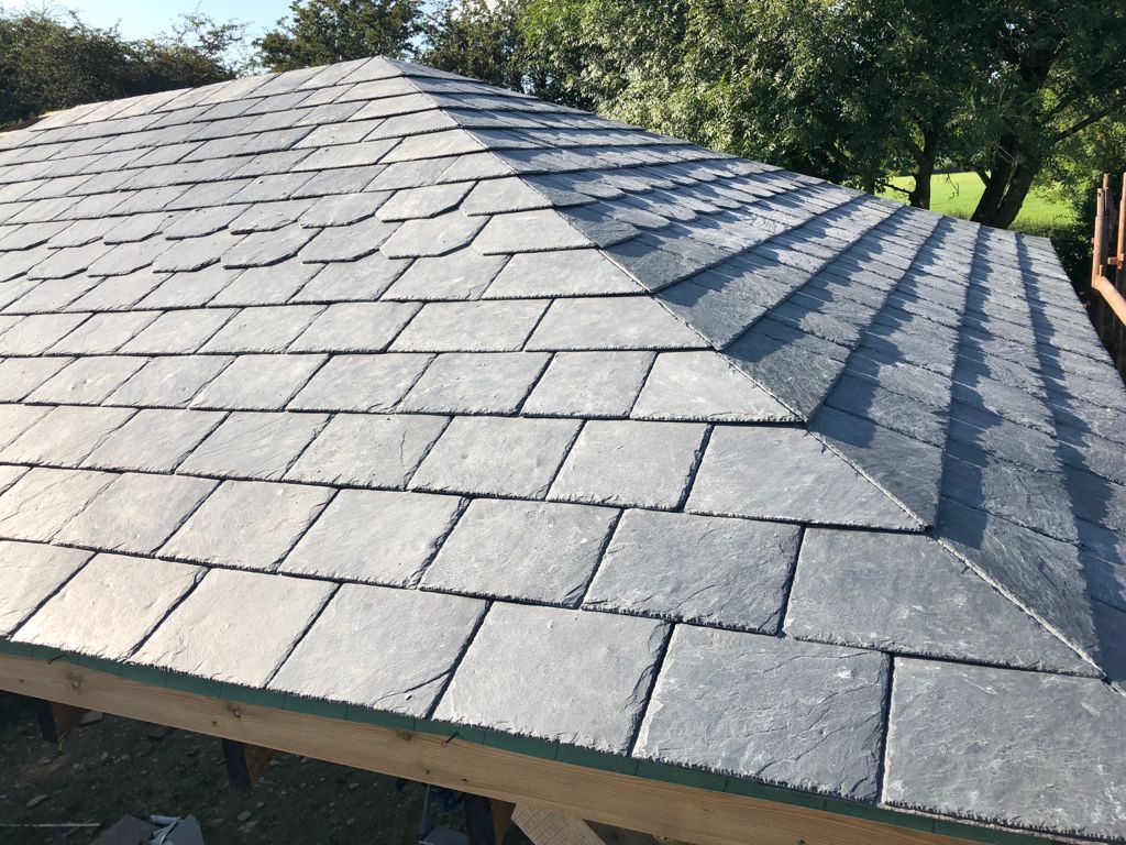Gray slate tiles on a multi-faceted gazebo roof.