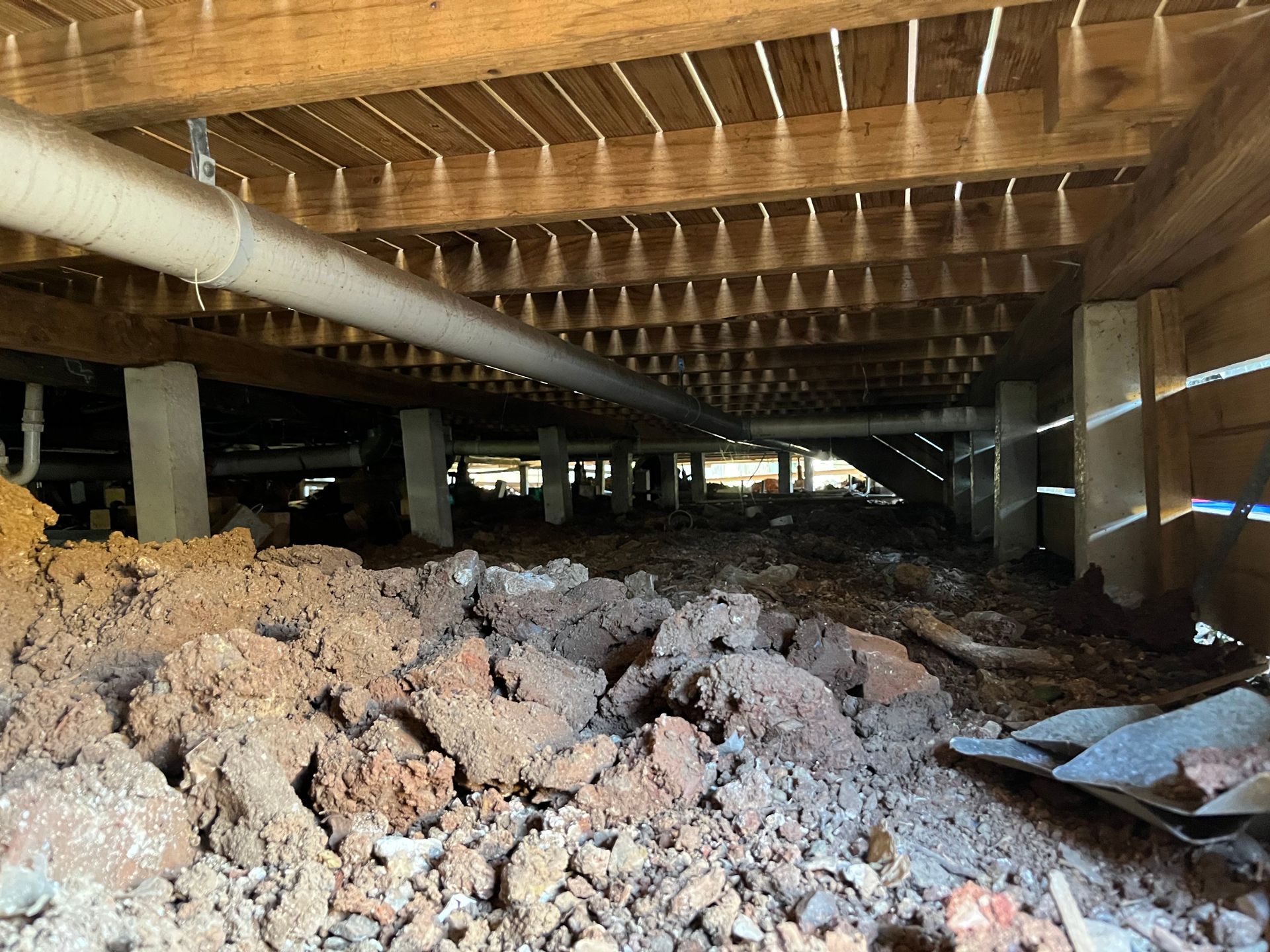 There is a lot of dirt underneath the house.