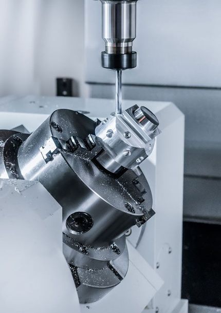 CNC machine milling a metal part.