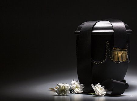Funeral urn, with tape and flower decorated