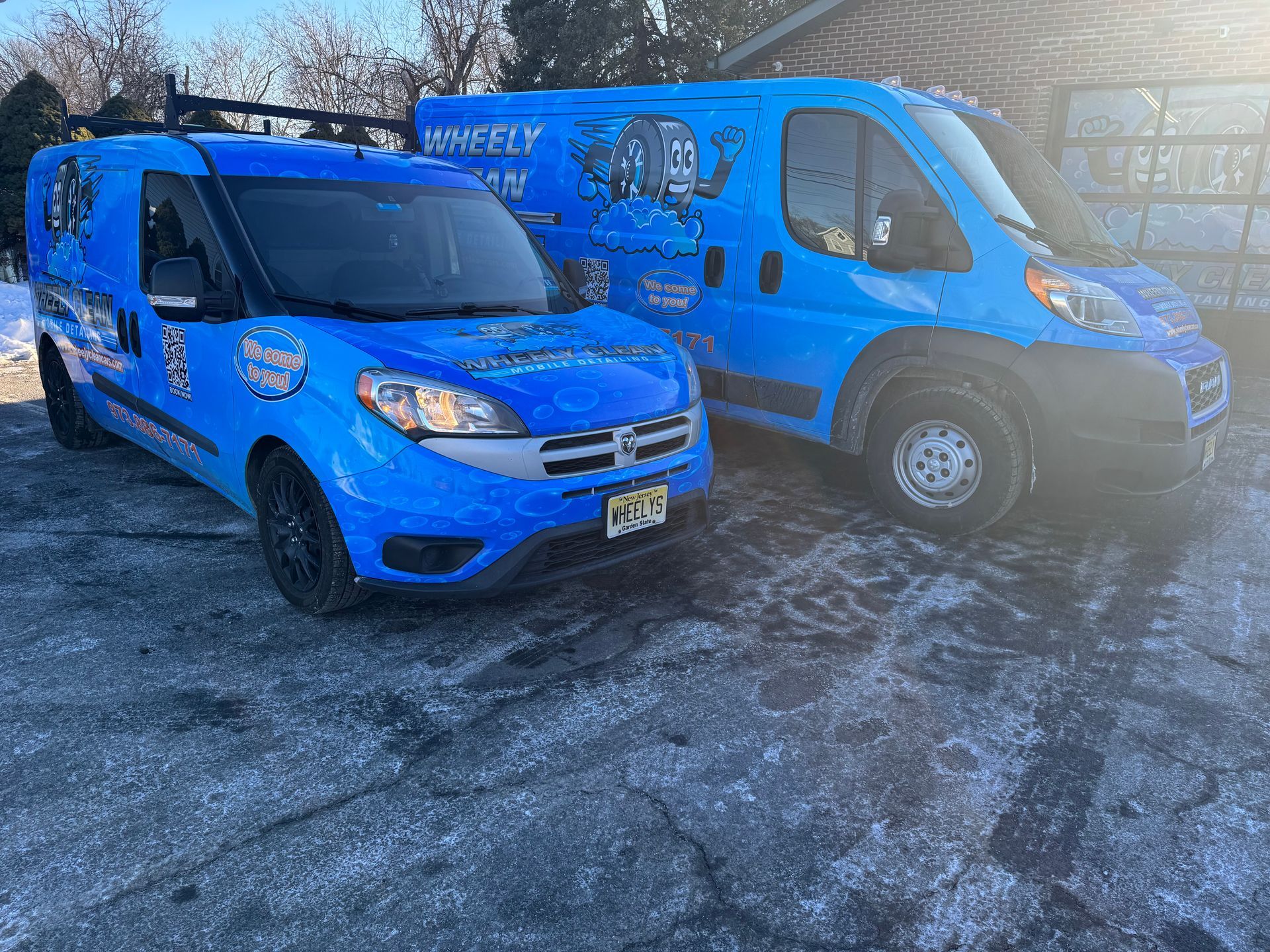 Gloved hand applying ceramic coating to a black car surface with an applicator sponge.