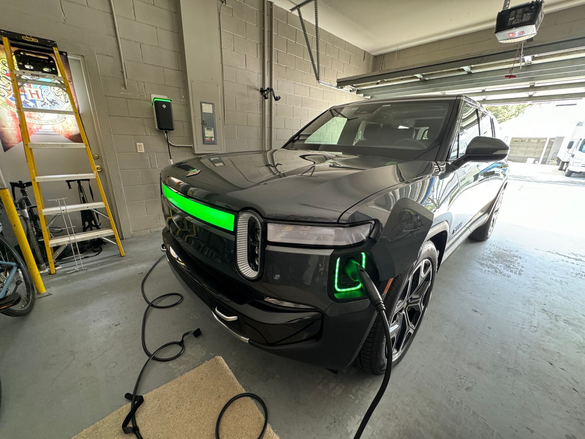 An electric car is being charged in a garage.