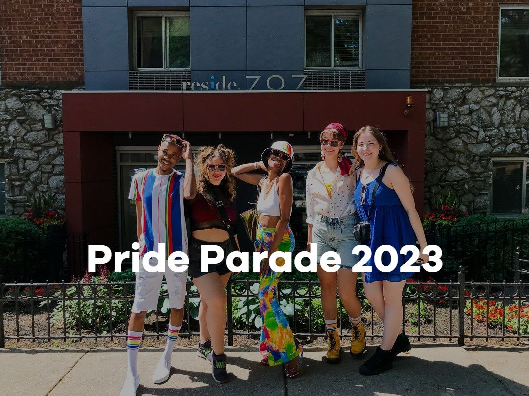 A group of people are standing in front of a building.