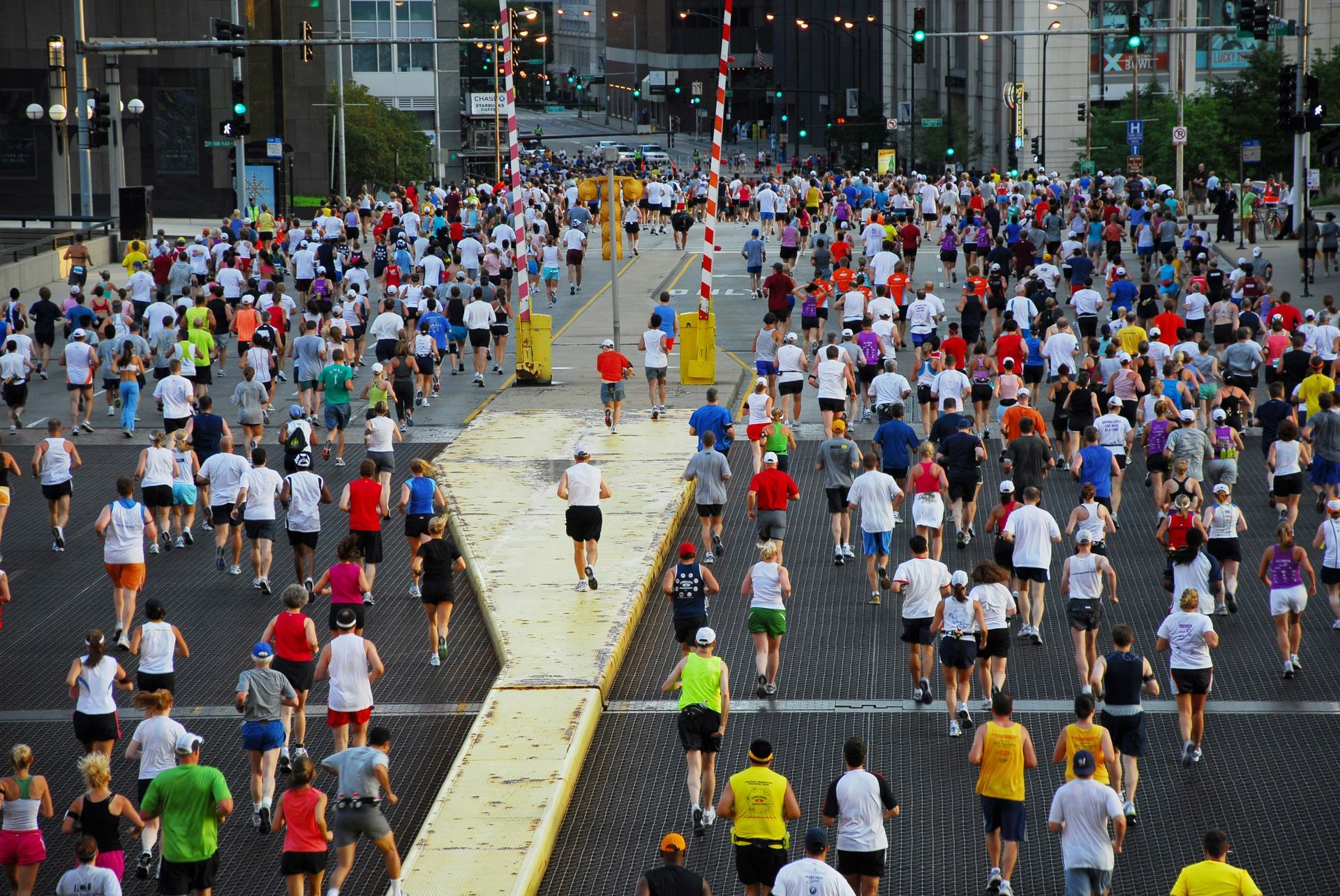 a large group of people are running in a marathon in Chicago.