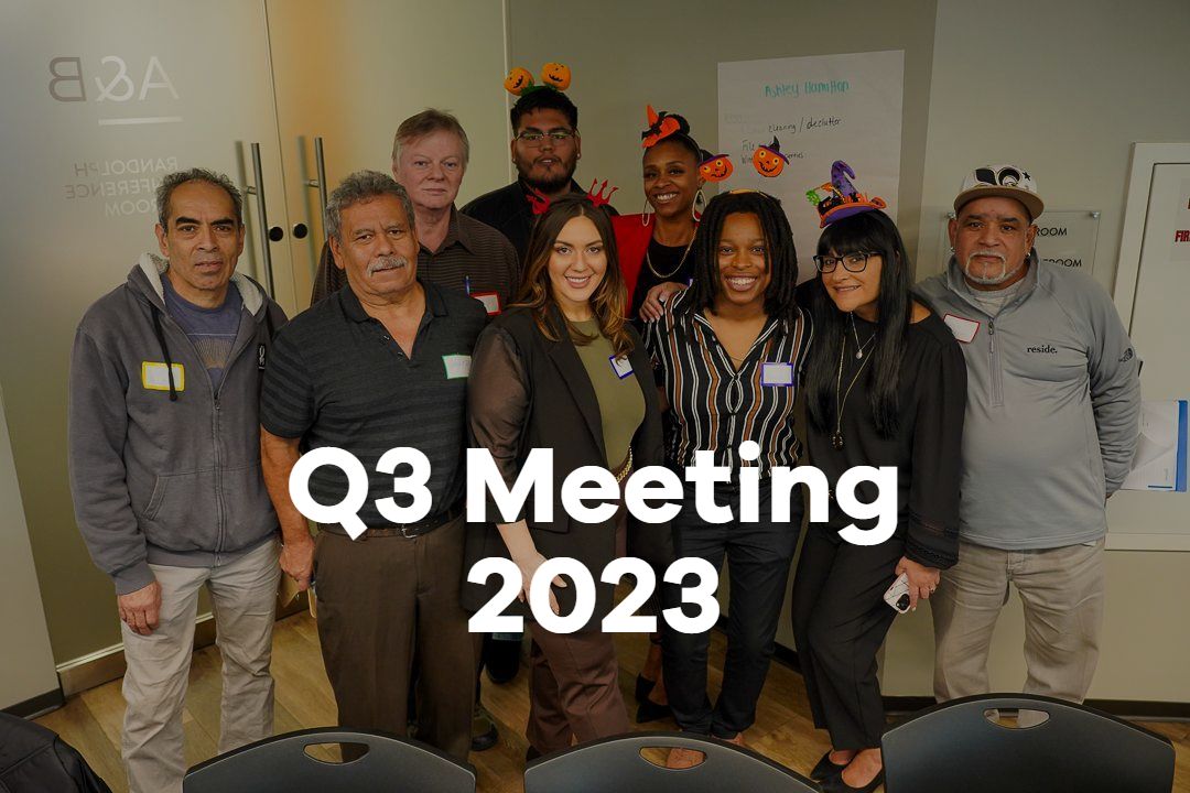 A group of people are posing for a picture in a room.