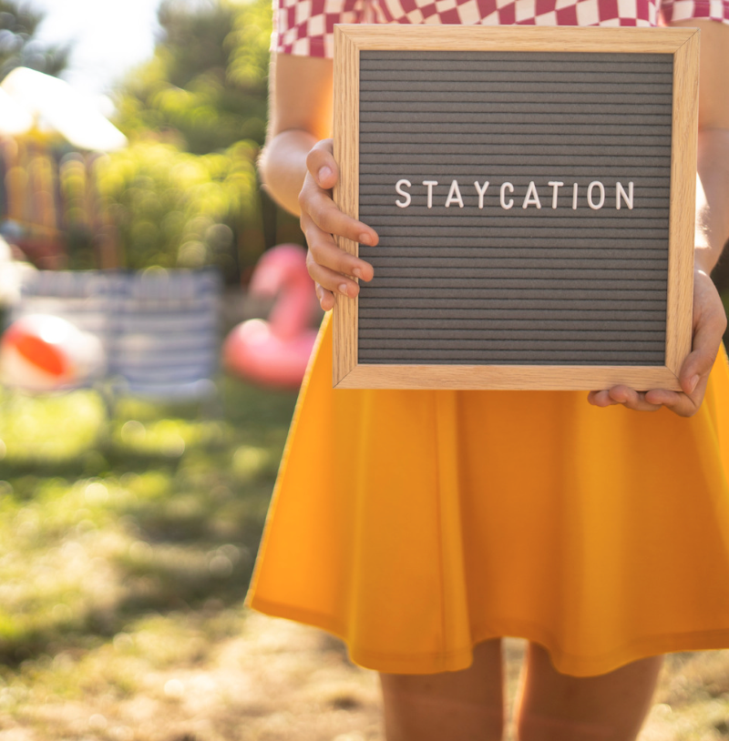 Person holding a sign that says 