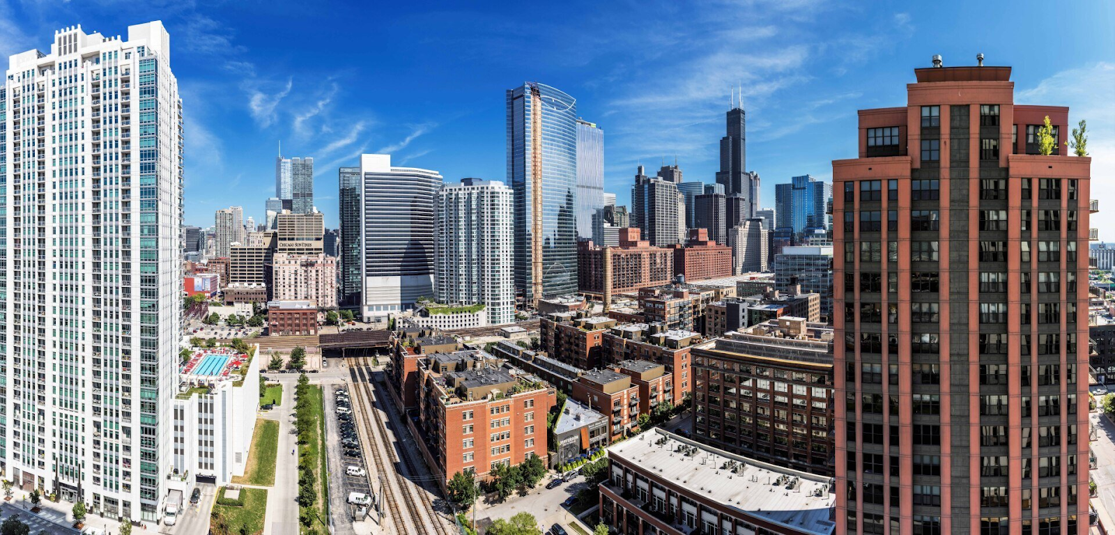 Aerial view of Westloop skyline with high-rise buildings and blue sky.