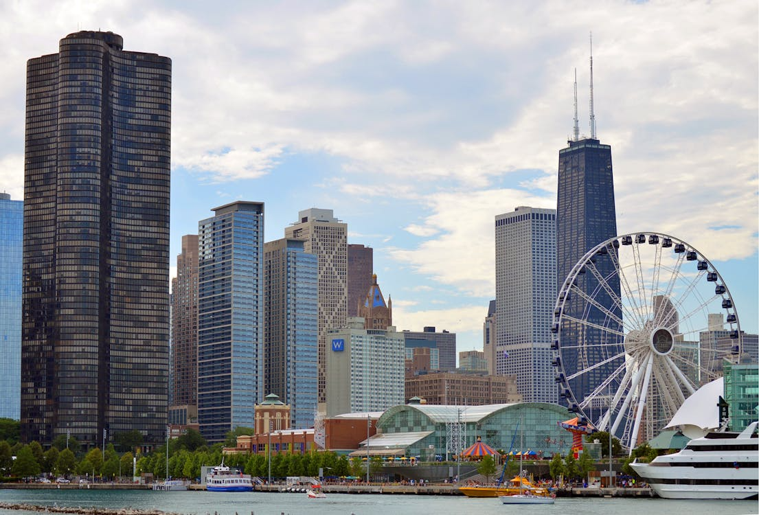 Chicago waterfront skyline with a Ferris wheel and modern high-rise buildings at dusk