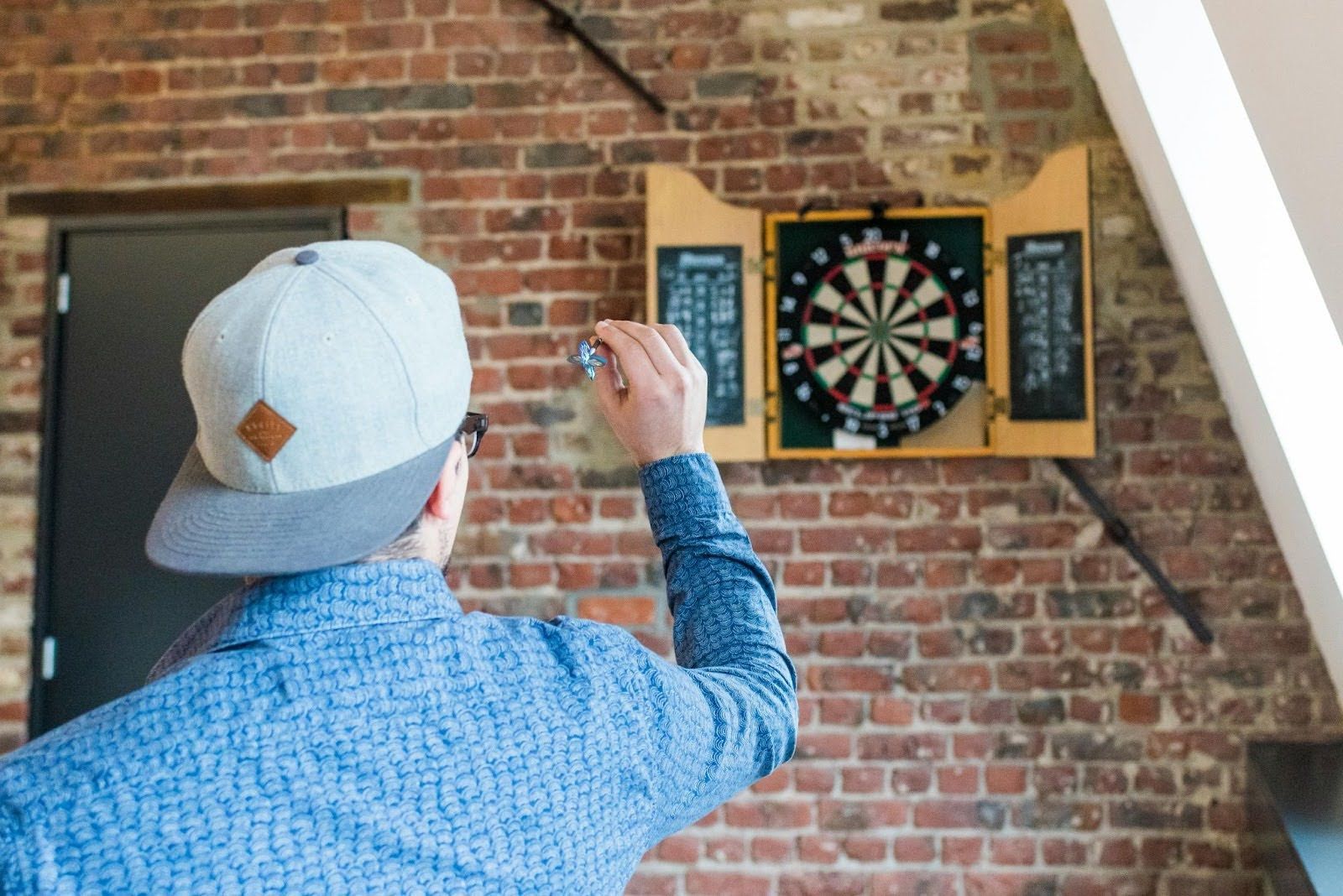 Man playing darts