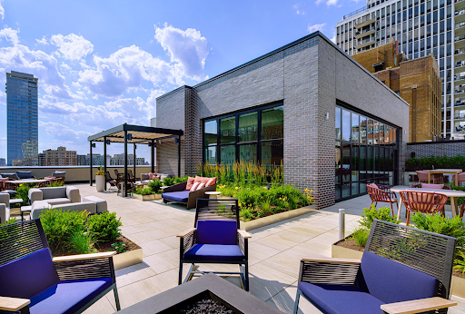 There is a fire pit on the roof of a building.