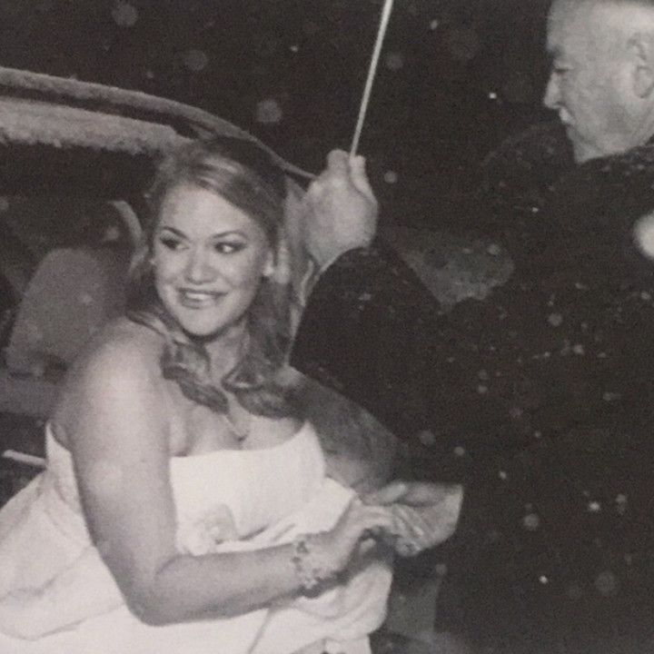 A black and white photo of a bride and groom