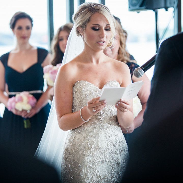 A woman in a wedding dress is reading a letter