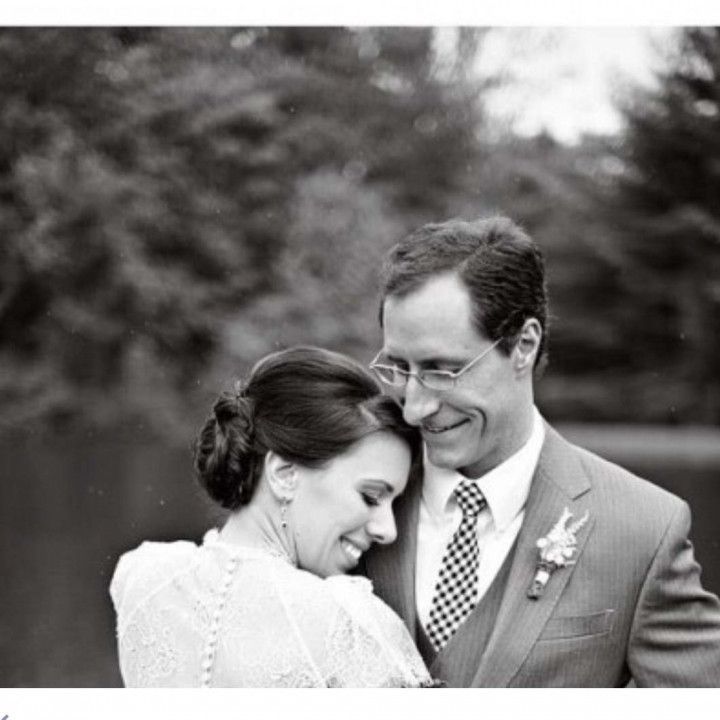 A black and white photo of a bride and groom