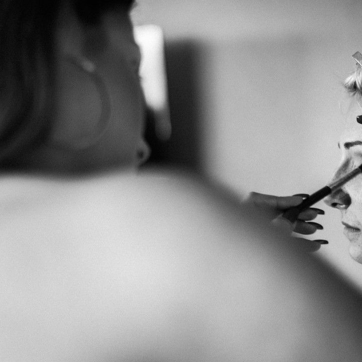 A black and white photo of a person holding a cell phone.