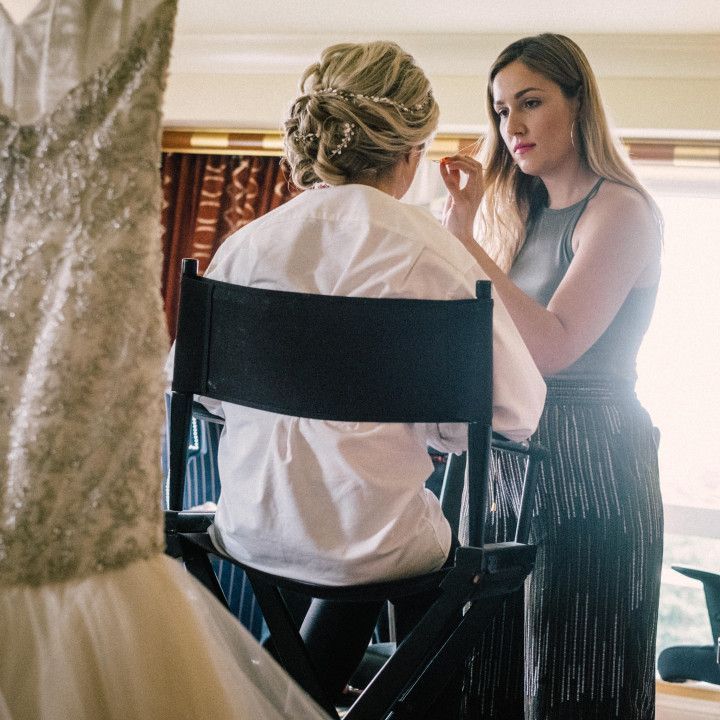 A woman sitting in a chair talking to another woman
