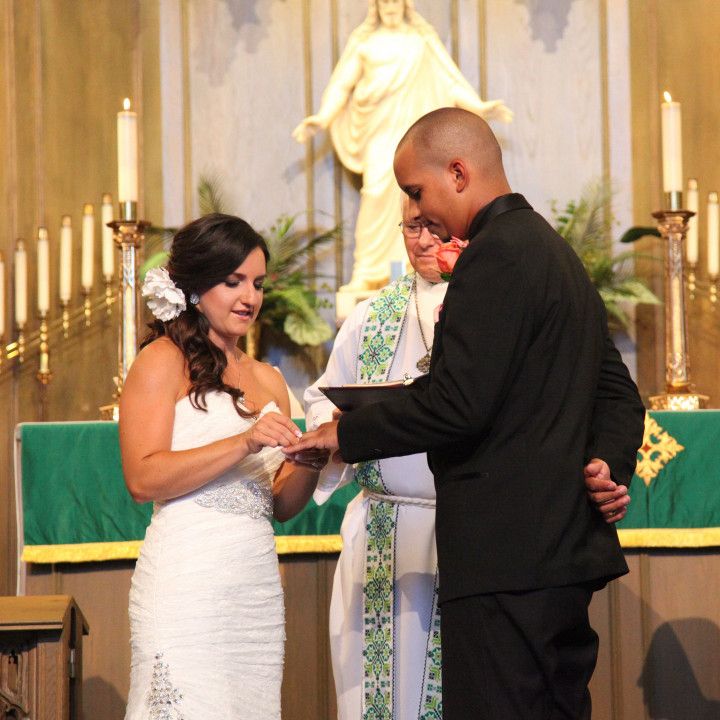 A bride and groom are getting married in a church