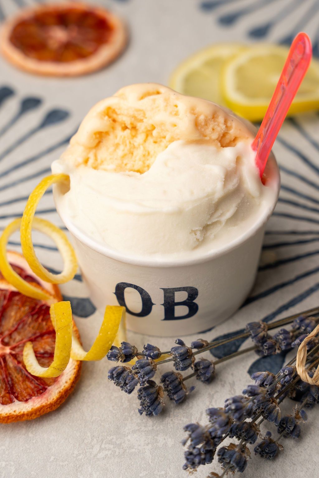 A cup of ice cream with the letter ob on it