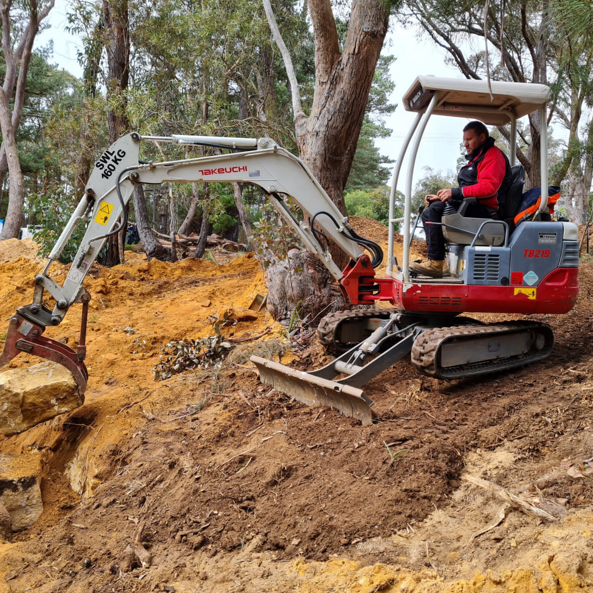 Mini excavator digging