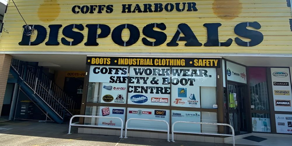 A Yellow Building With A Sign β Coffs Disposals, Workwear, Safety & Boot Centre in Coffs Harbour, NSW