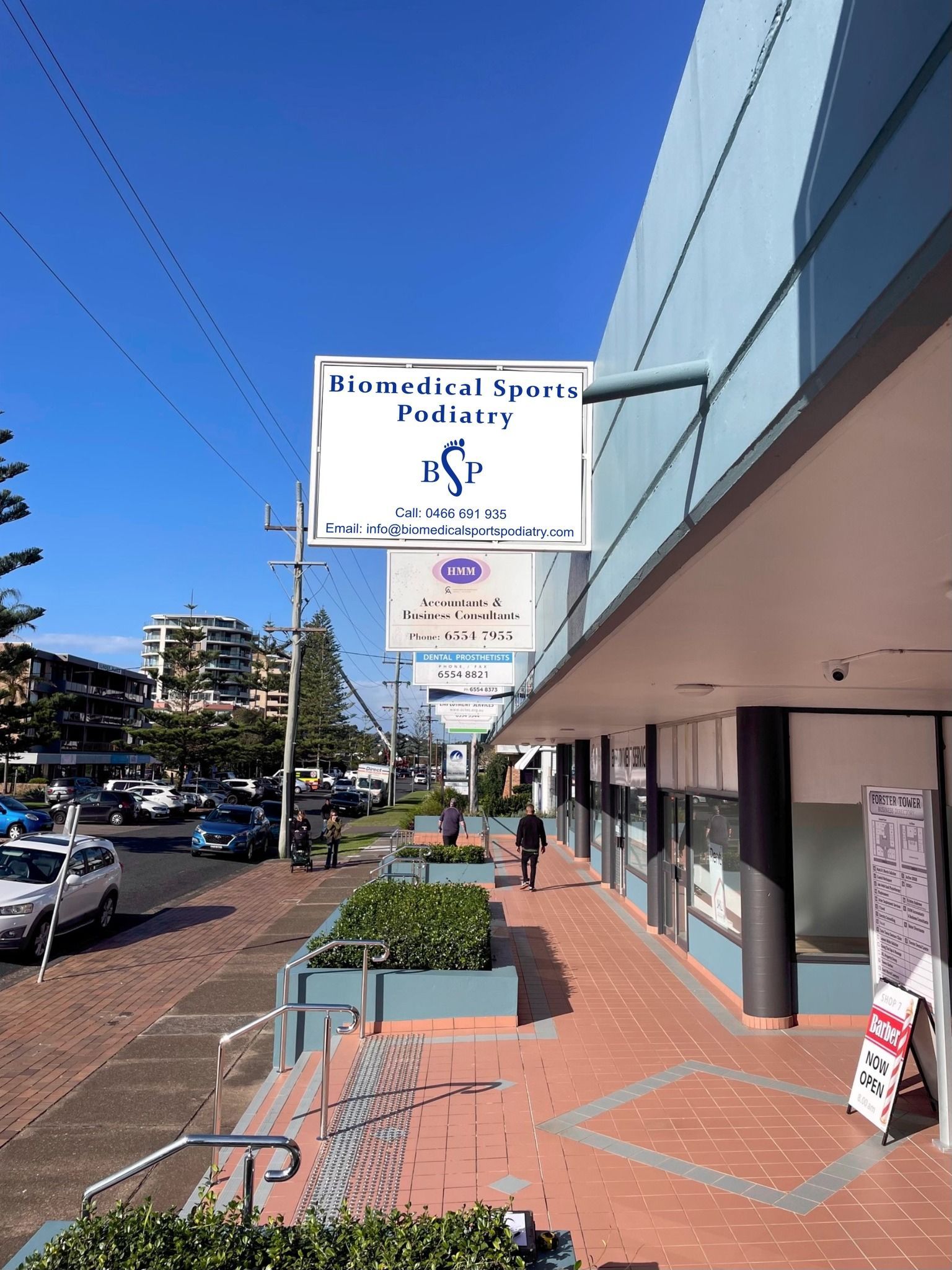 the outside of a shop with a Biomedical Sports Podiatry sign  — Biomedical Sports Podiatry in Diamond Beach, NSW