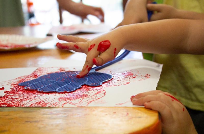 Child painting. Childcare, kindy, Montessori, Gold Coast, Warwick, Jindabyne.