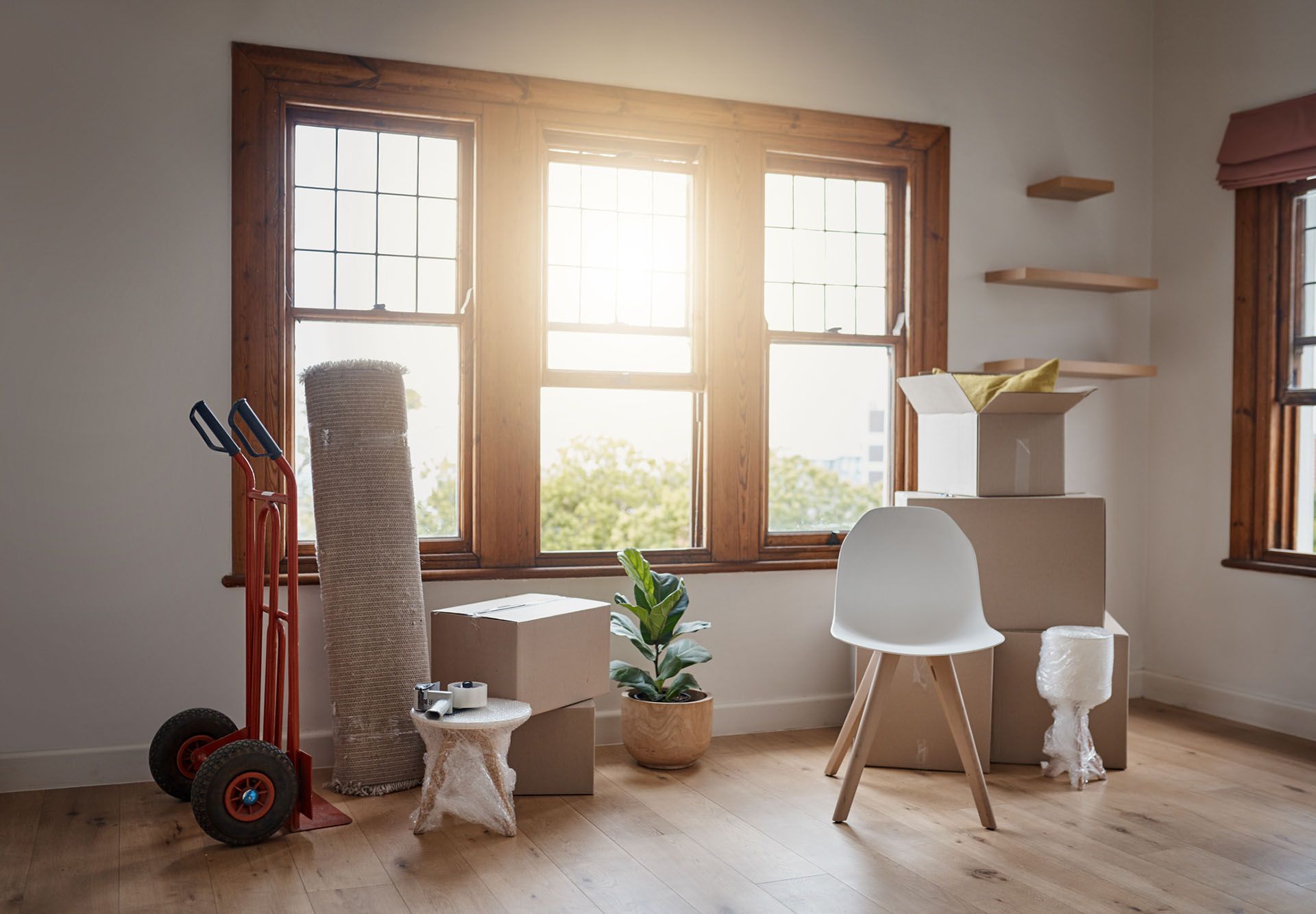 Furniture removals setup showing packed boxes and home furniture prepared for transport.