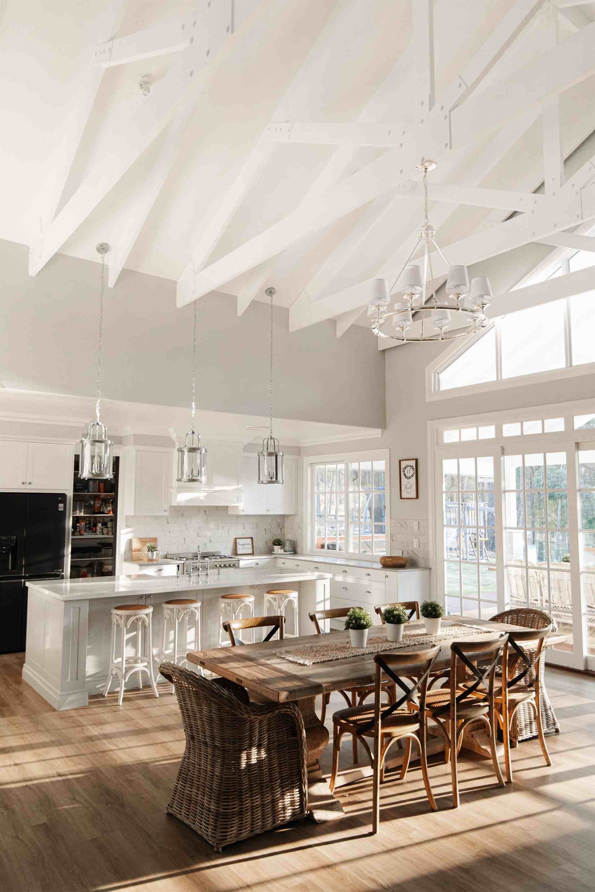 A Kitchen and Dining Room in a House With a Large Table and Chairs — Michael Duncan Constructions Pty Ltd in Robina, QLD