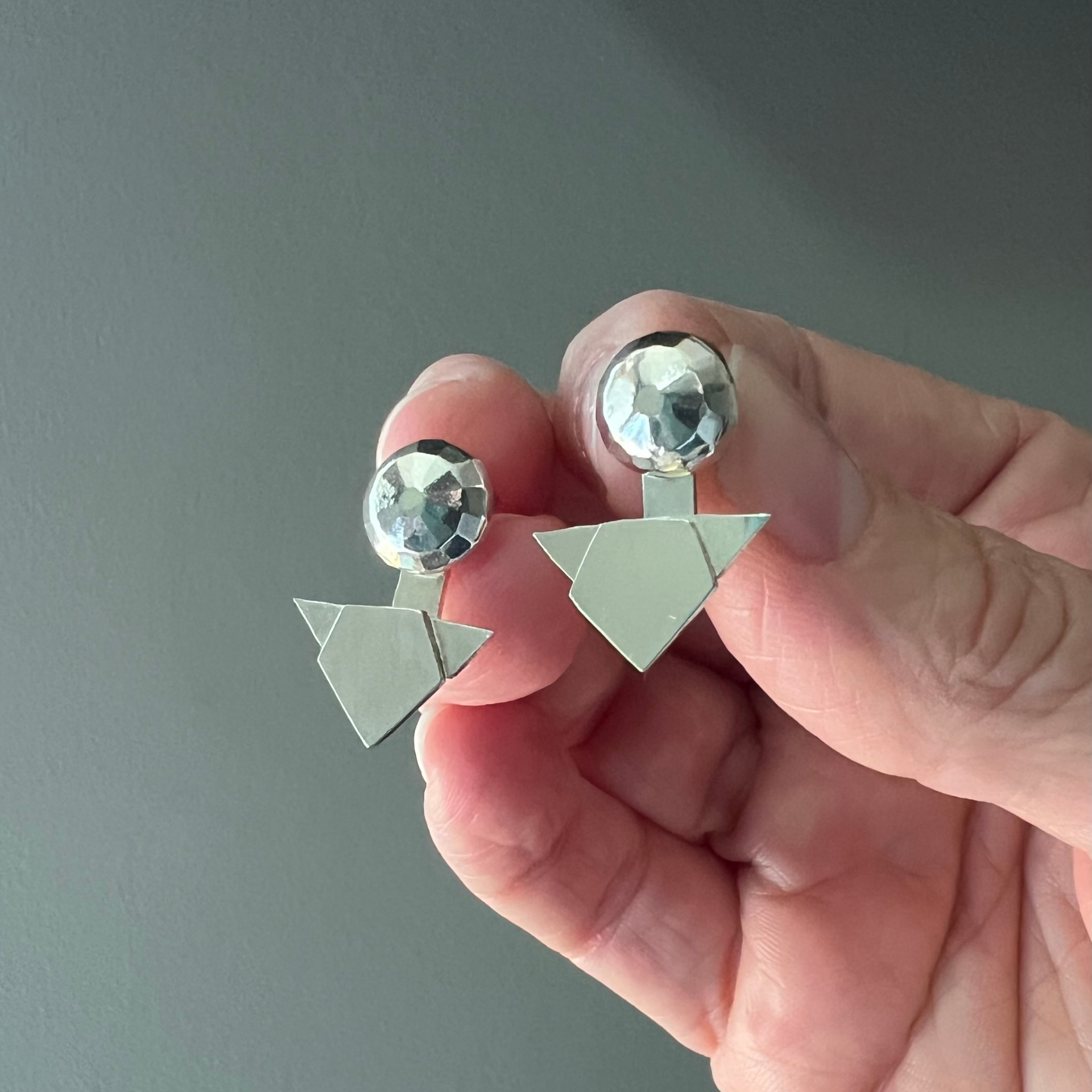 Wild Sunflower Silver Handmade Jewelry One is a stud, the other a geometric design.