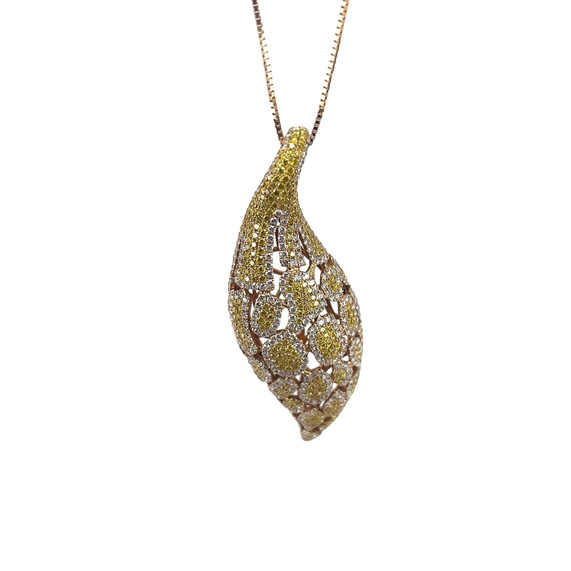 A necklace with a pendant in the shape of a leaf