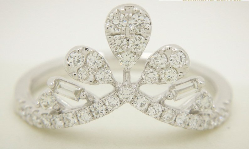 A white gold ring with diamonds in the shape of a crown