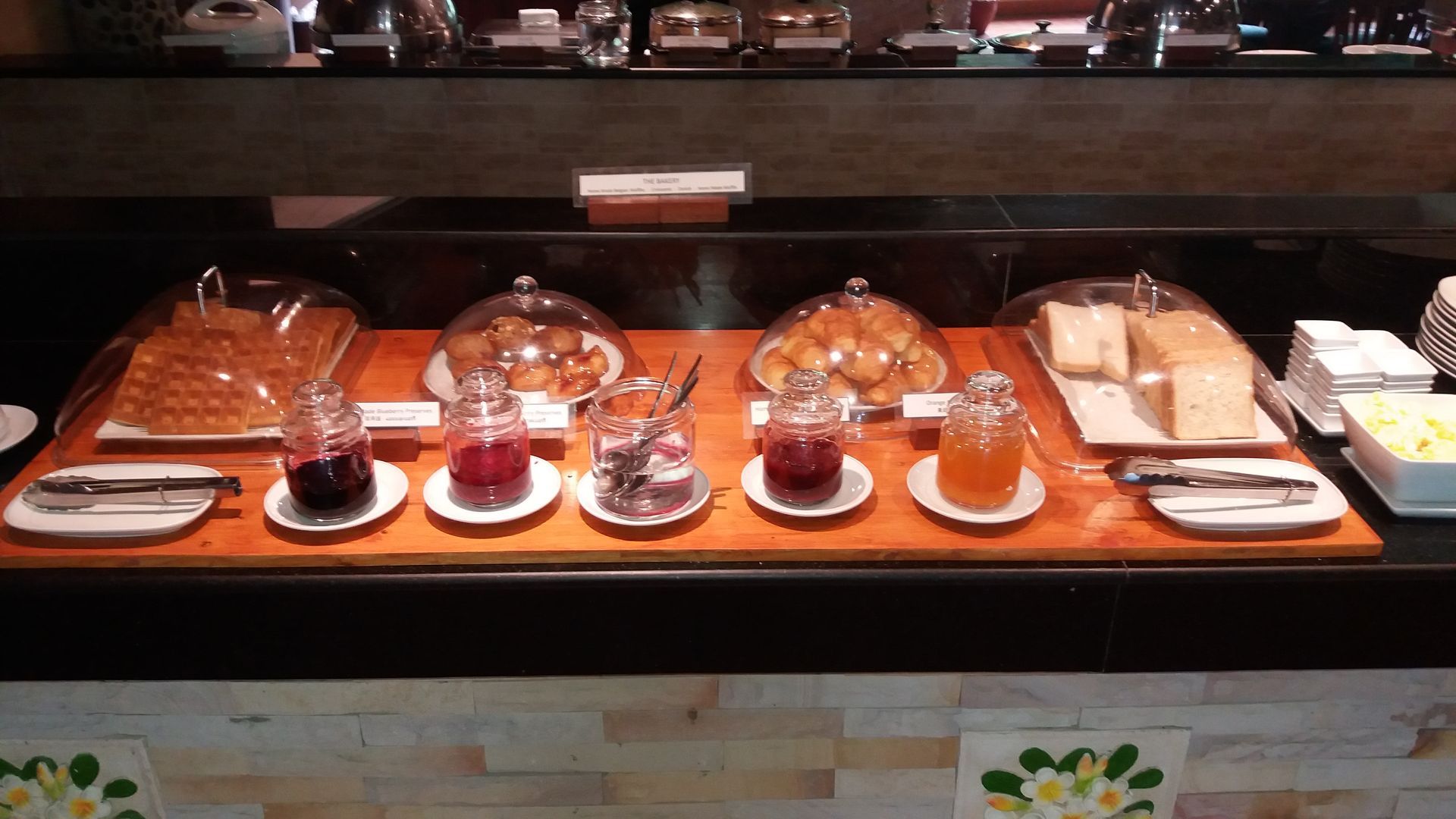 A buffet table with a variety of food on it